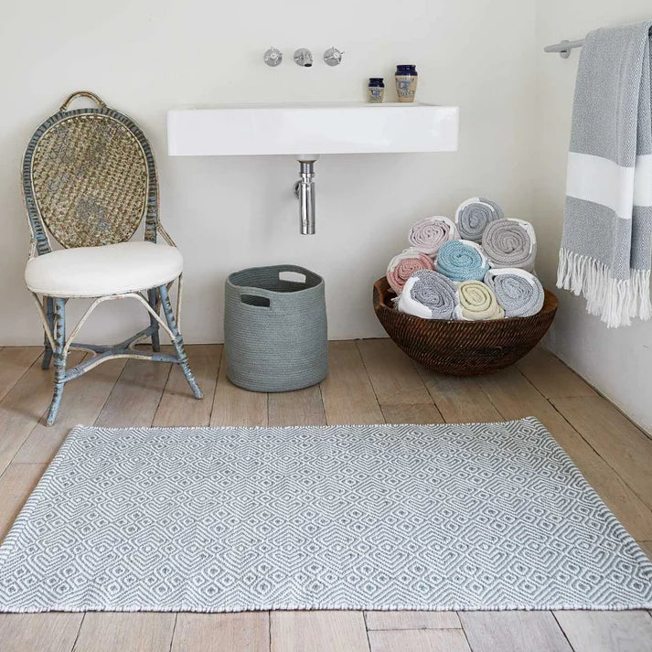 Weaver Green Dove Grey Provence Rug in a bathroom with co-ordinating soft furnishings
