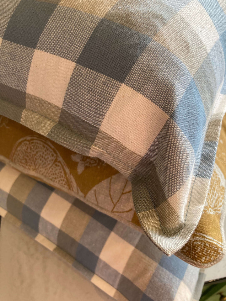 blue check and golden yellow design cushion