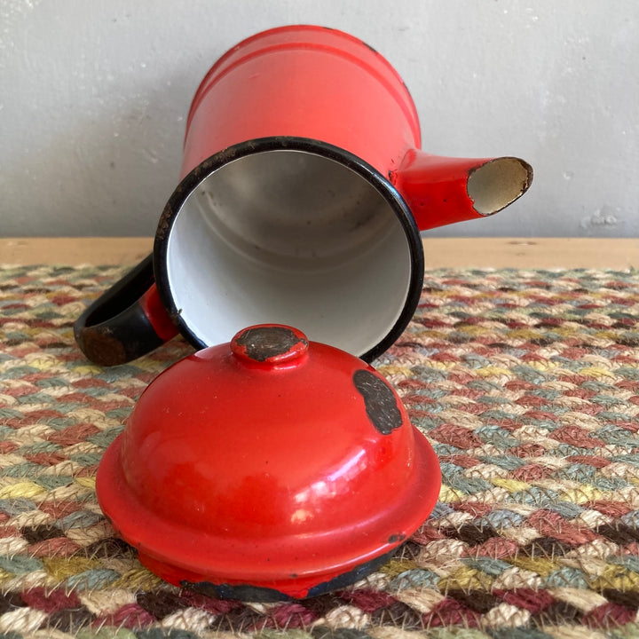 Vintage red enamel tea and coffeepot by Source for the Goose Devon, showcasing rustic charm and a well-used look.