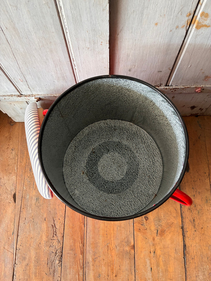 Top view of quirky red enamel stool with blue ticking lid, showing marbled interior for storage, from Source for the Goose, Devon.