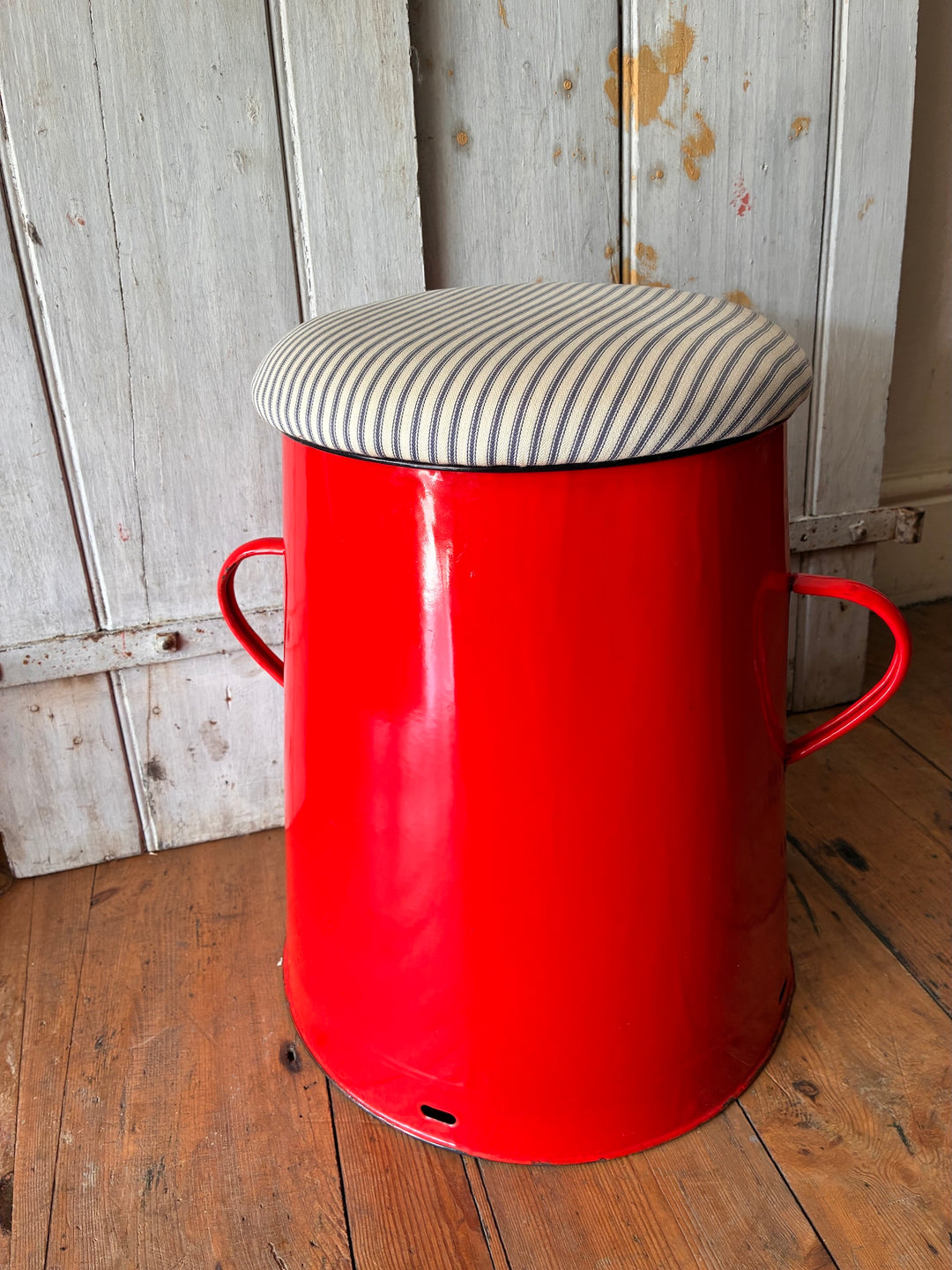 Quirky red enamel stool with blue stripe ticking lid, perfect for stylish storage and seating from Source for the Goose, Devon.