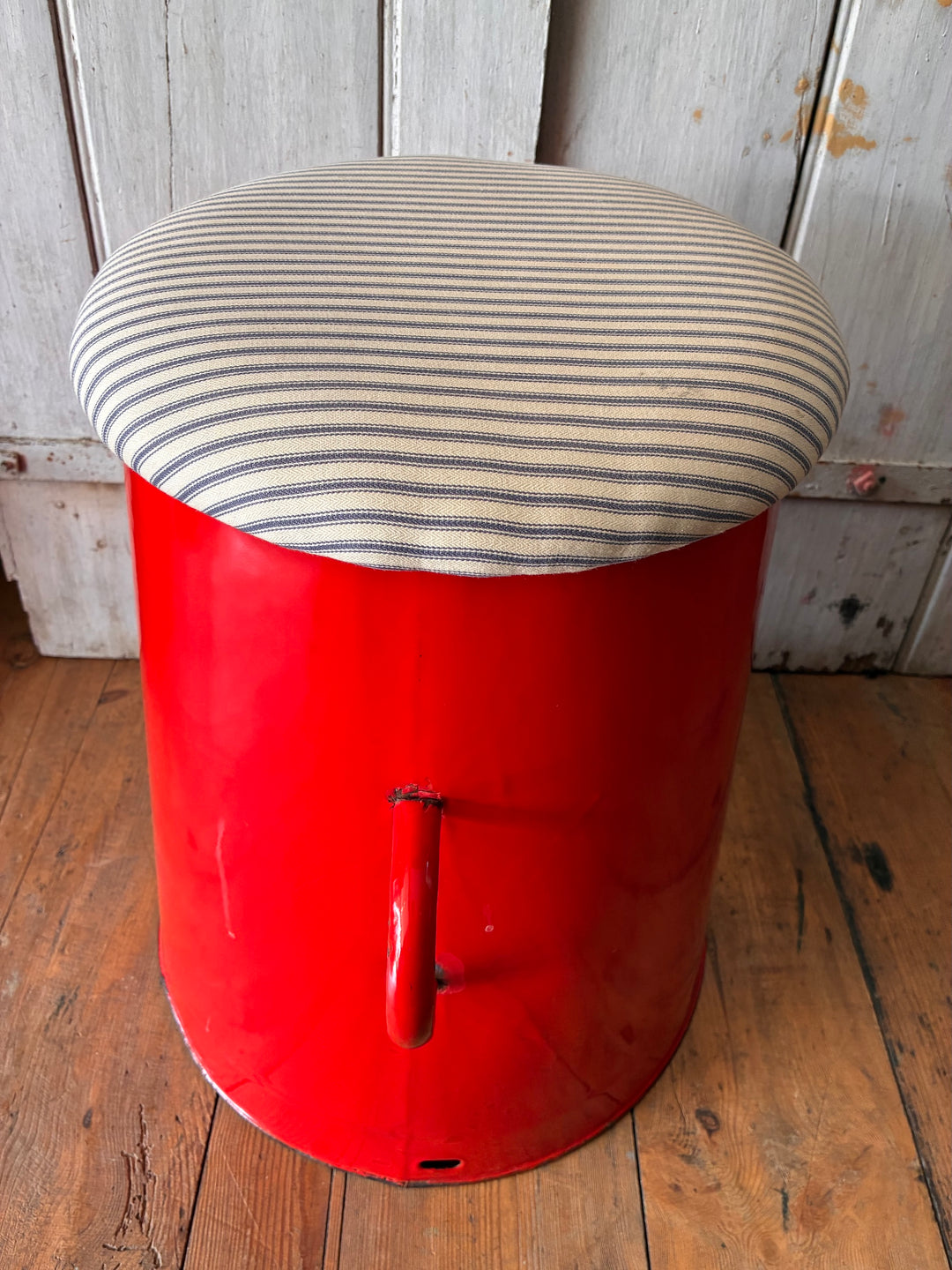 Quirky red enamel stool with striped ticking lid, perfect for stylish storage and seating from Source for the Goose, Devon.