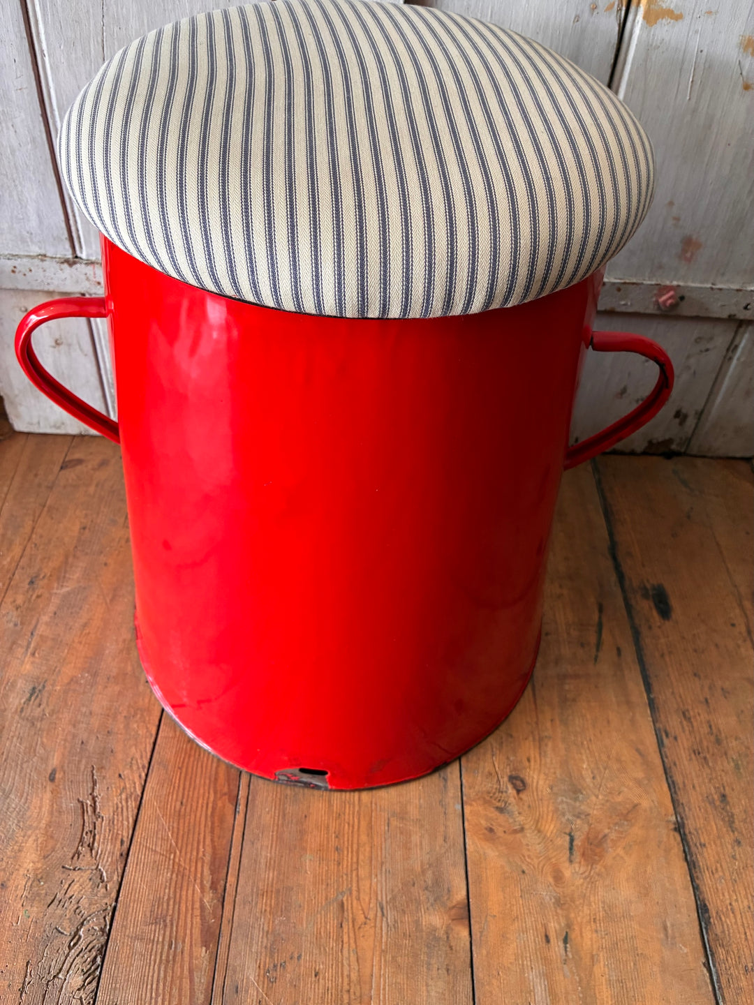 Quirky red enamel stool with blue stripe ticking lid, perfect for storage and stylish seating from Source for the Goose in Devon.