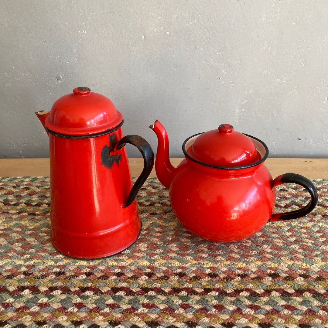 Vintage red enamel tea and coffee pot set, rustic charm perfect for country kitchen decor from Source for the Goose, Devon.