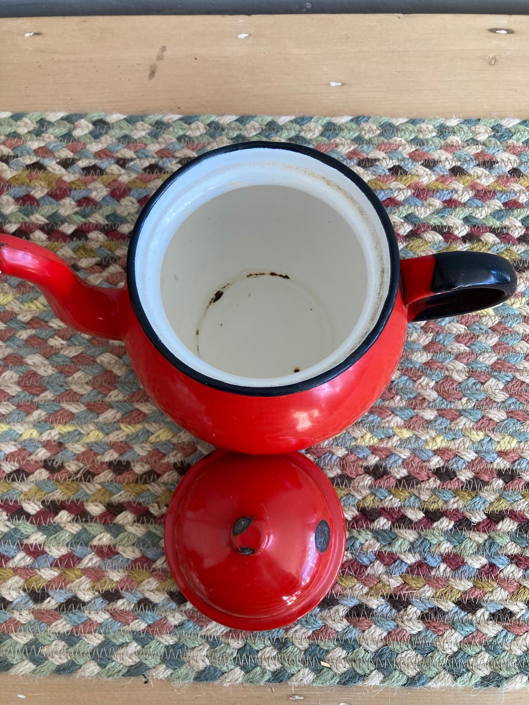 Vintage red enamel tea and coffeepot with black accents, perfect for a rustic kitchen, sourced from Source for the Goose, Devon.