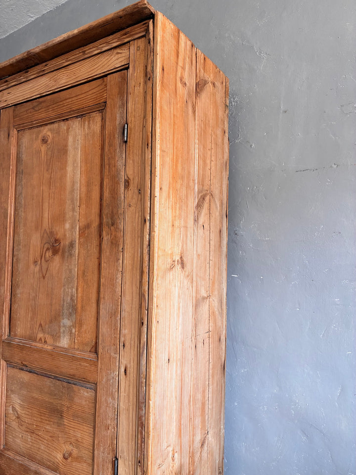 Tall Rustic Pine Housekeepers Cupboard corner view showing the rich wood grain and rustic charm of the cupboard.