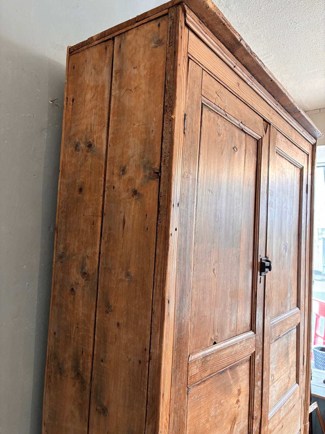 Tall Rustic Pine Housekeepers Cupboard showcasing rustic wood grain and authentic wear.
