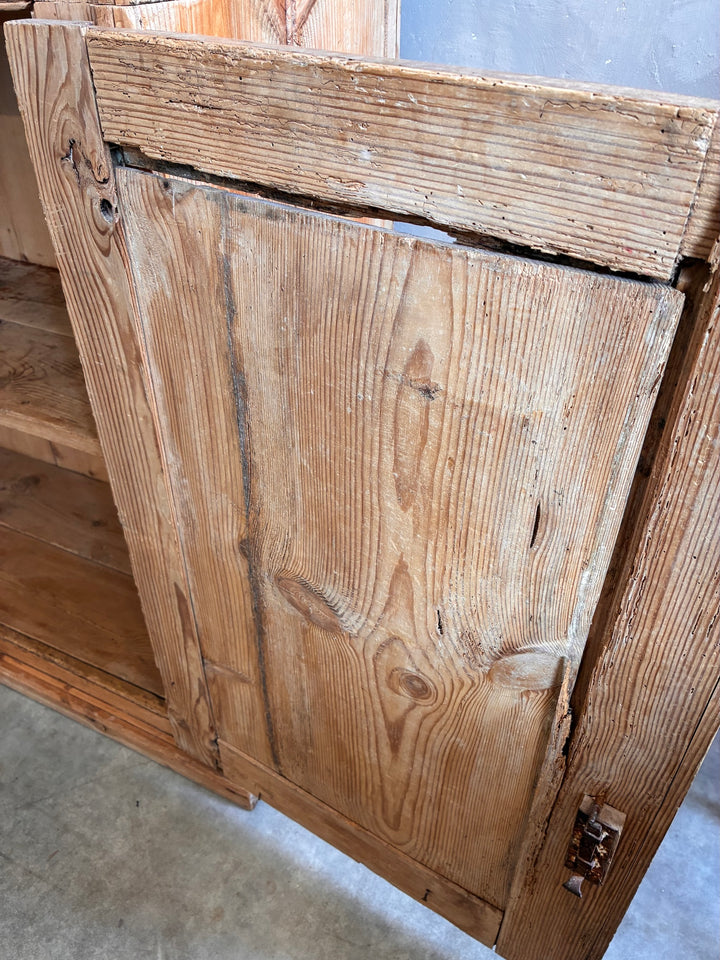 Close-up of the weathered wood on a Tall Rustic Pine Housekeepers Cupboard from Source for the Goose, Devon.