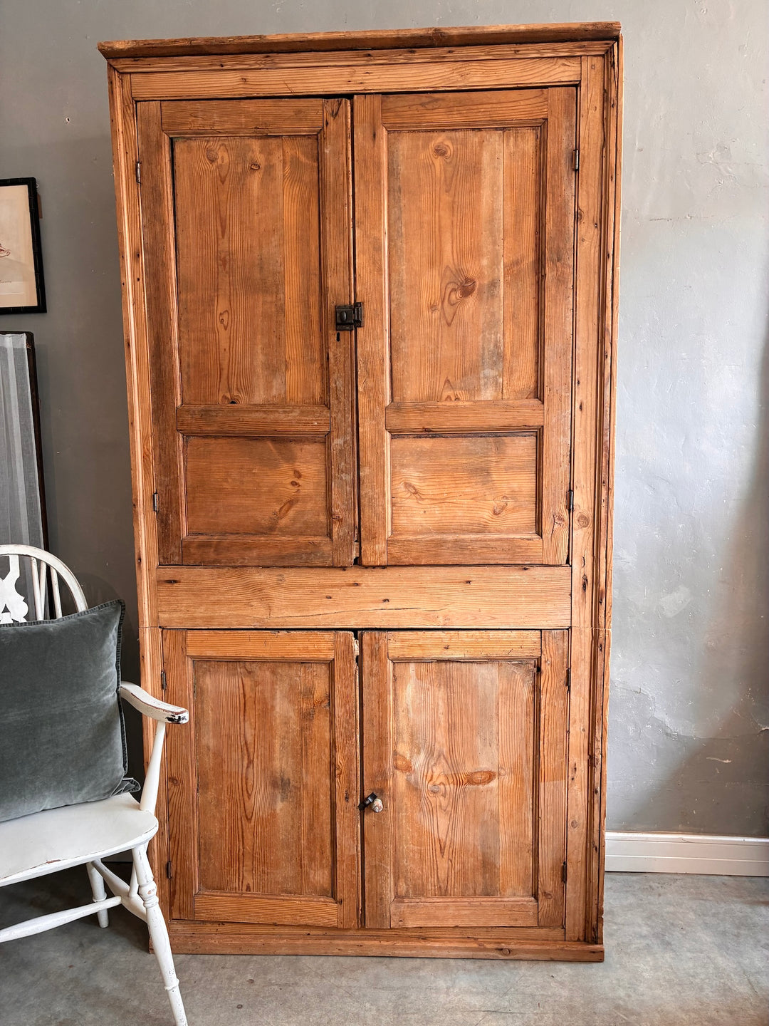 Tall Rustic Pine Housekeepers Cupboard showcasing aged wood and rustic charm.