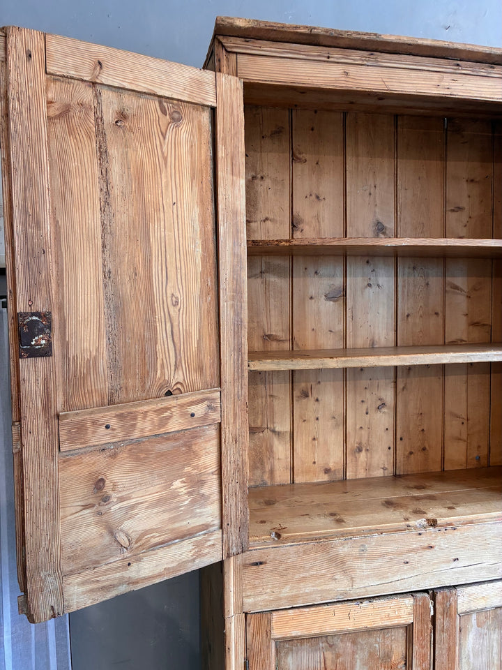 Tall Rustic Pine Housekeepers Cupboard with open door showcasing shelving.