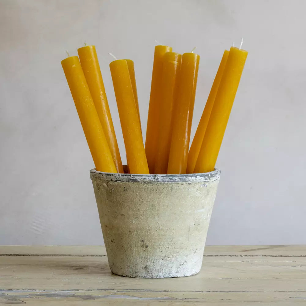Set of Three Rustic Yellow Ochre Dinner Candles in a rustic pot, adding warmth to any dining table.