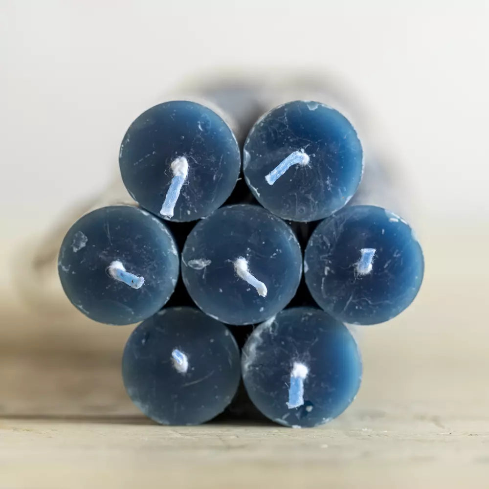 Set of Three Rustic Inky Blue Dinner Candles stacked together, showcasing their elegant deep blue color.