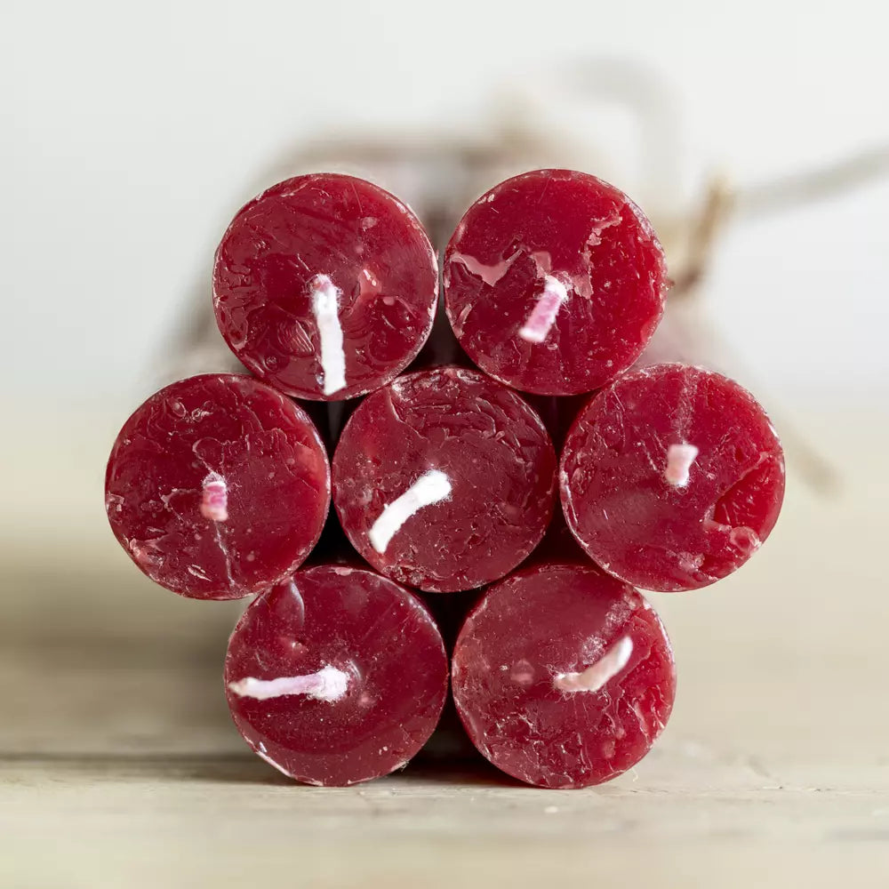 Set of Three Rustic Plum Red Dinner Candles in a stacked arrangement, showcasing warm plum red tones by Source for the Goose Devon.