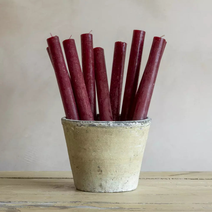 Set of Three Rustic Plum Red Dinner Candles in a vintage pot, adding charm to any home decor.
