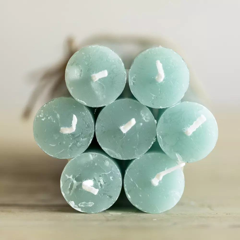 Set of Three Rustic Sea Green Dinner Candles stacked together, showcasing their beautiful sea foam color.