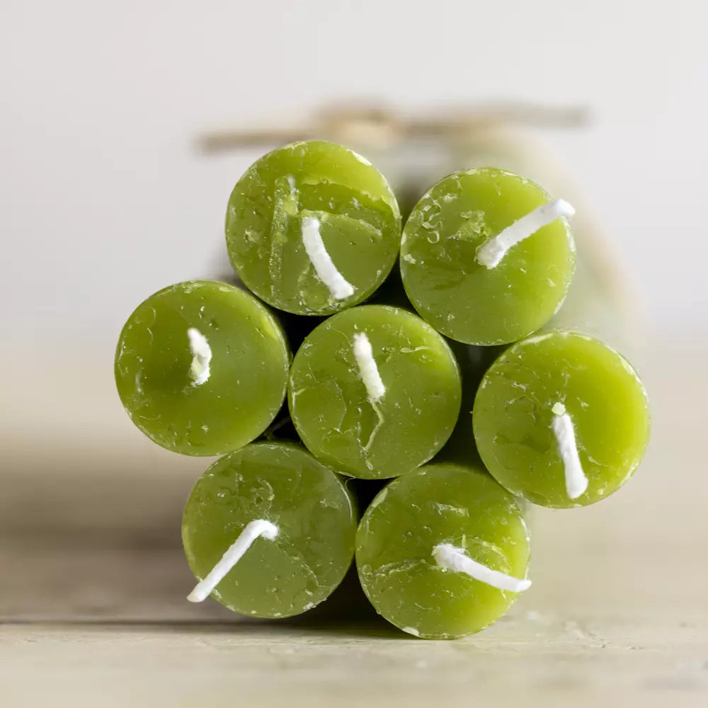 Set of Three Rustic Fern Green Dinner Candles displayed from above, showcasing their vibrant green color and candle wicks.