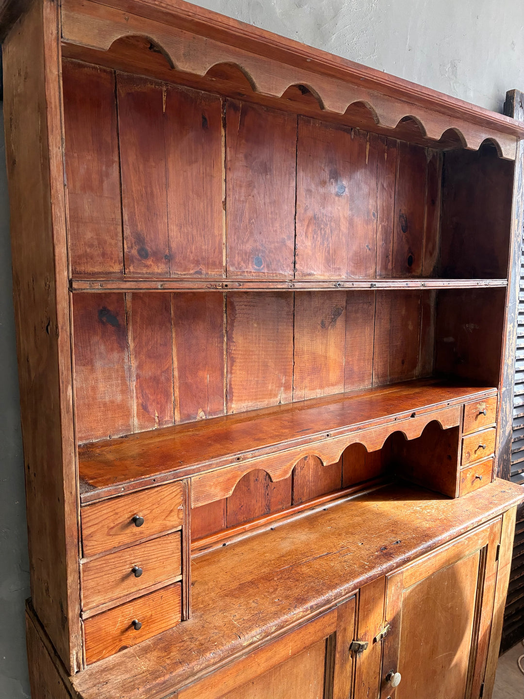 Rustic Antique Pine Dresser showcasing its aged wood, shelves, and practical storage for country kitchen decor.