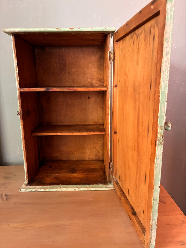 Small Green Wooden Cabinet - vintage with open door showing interior shelves and wood finish.