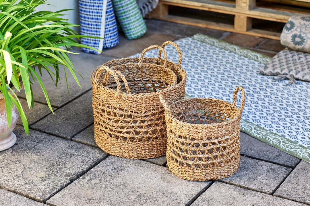 Round Seagrass Basket with Handles in two sizes, handwoven seagrass storage solution for home decor.