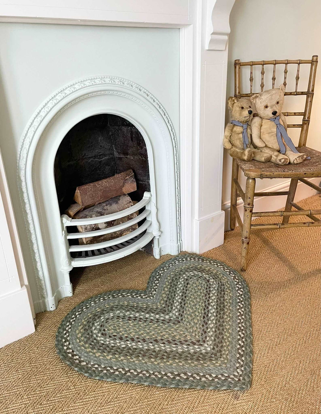 heart shaped rug in Seaspray in front of an old fireplace