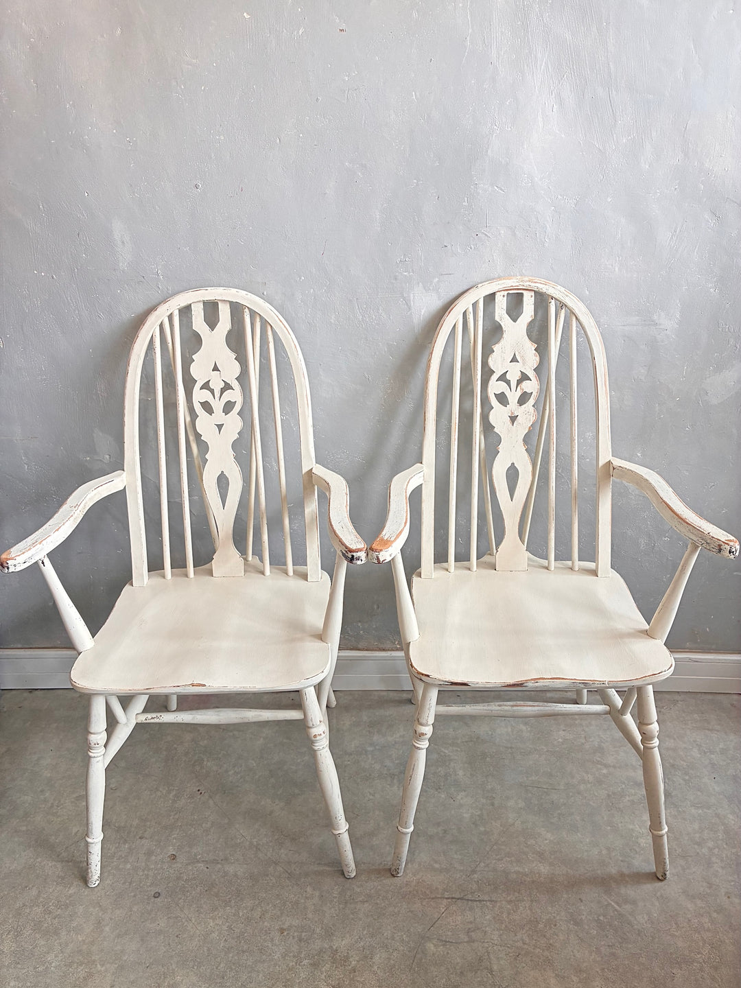 Set of Four Painted Wheelback Carver Chairs with carved wheel motif and warm white finish, from Source for the Goose Devon.