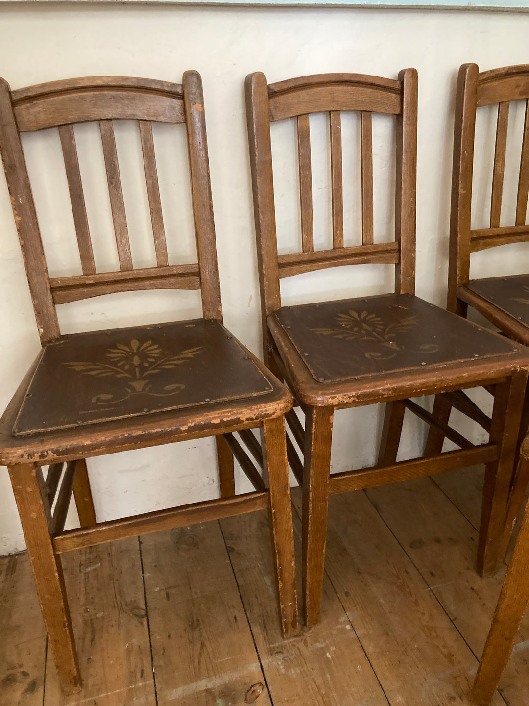 brown scumbe painted dinings chairs with stencilled wooden seat
