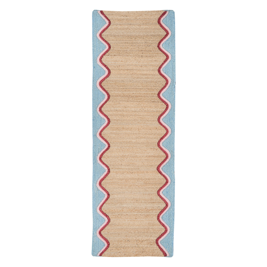 Sky Wave Organic Jute Braided Rug with sky blue wave border and pink trim, ideal for hallways and living spaces.