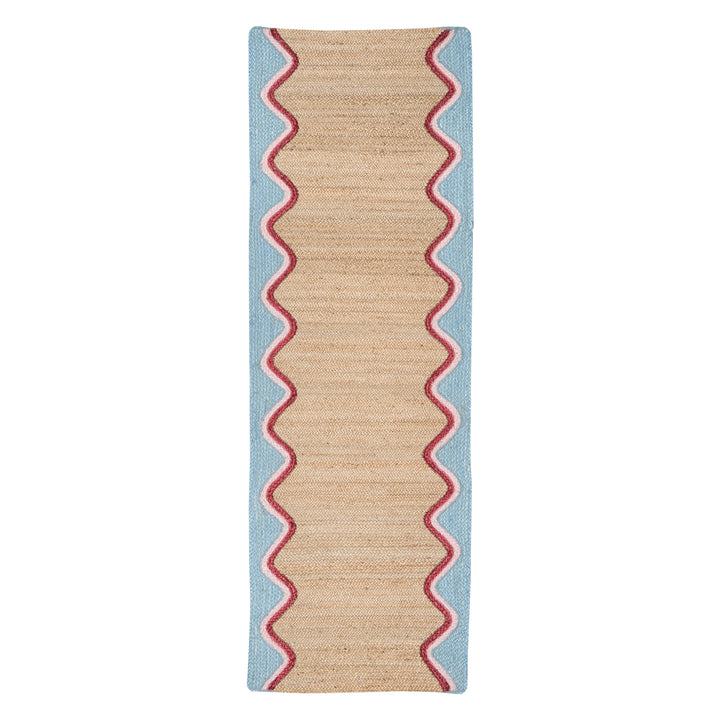 Sky Wave Organic Jute Braided Rug with sky blue wave border and pink trim, ideal for hallways and living spaces.