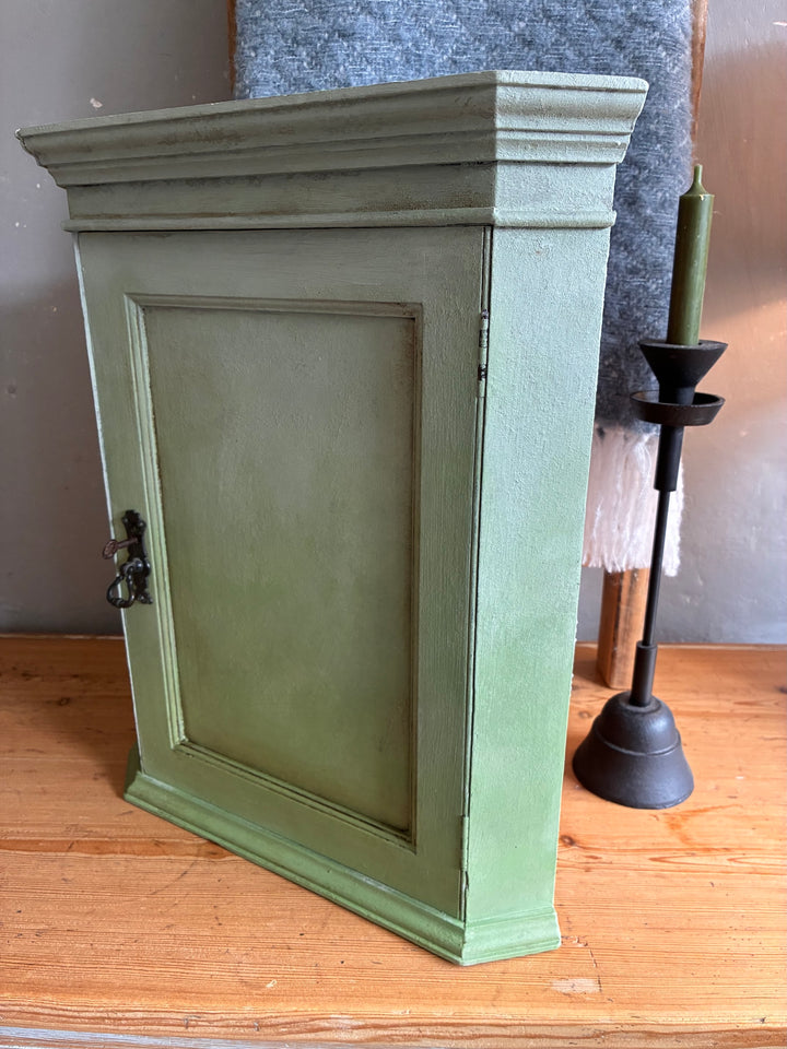 Small Vintage Green Painted Wall Cupboard with original black metal escutcheon, perfect for charming storage.