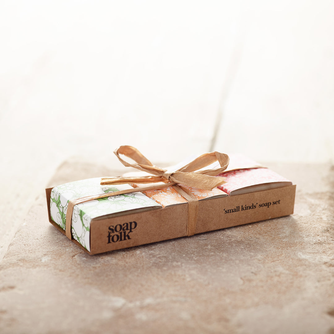 a mix of three small soaps wrapped in eco kraft paper and ribbon