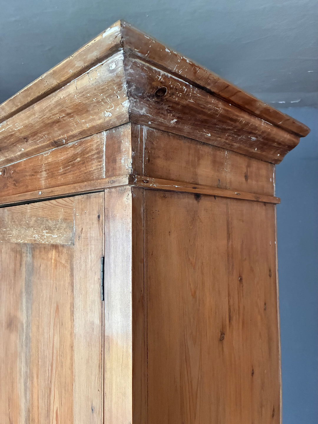 Close-up view of the top of the Victorian Stripped Pine Linen Cupboard, showcasing its detailed finish and wood grain.