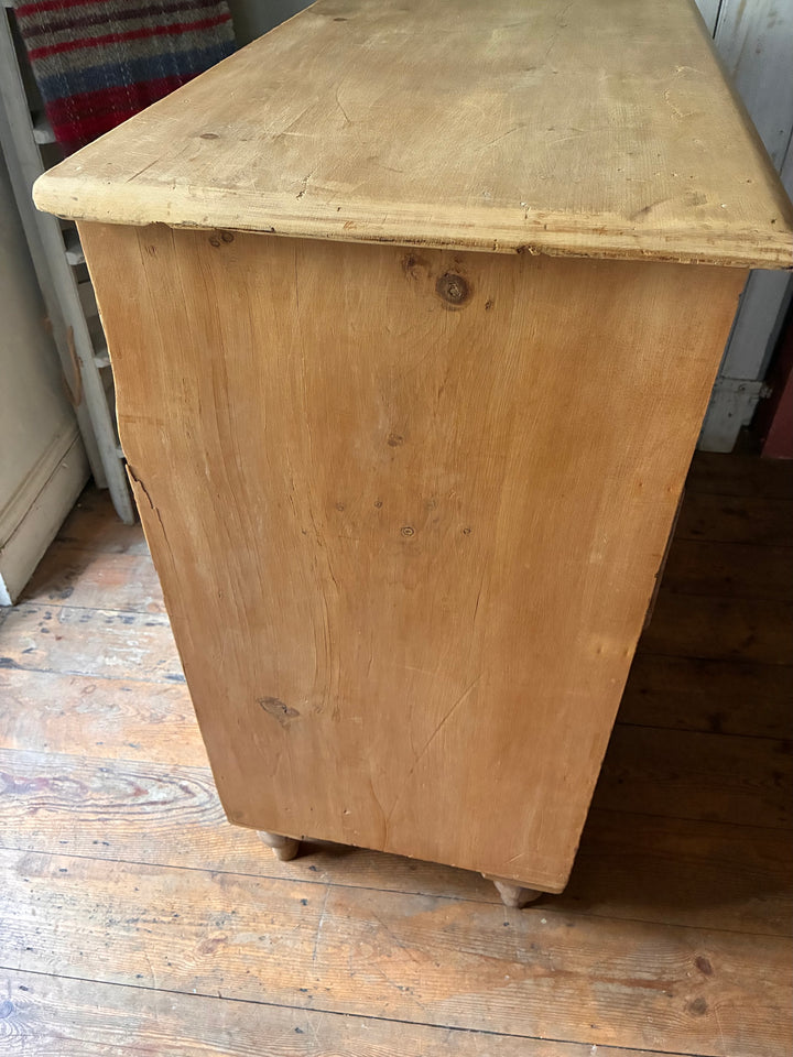 Tall Rustic Antique Pine Chest of Drawers showcasing natural wood grain and classic design for storage solutions.