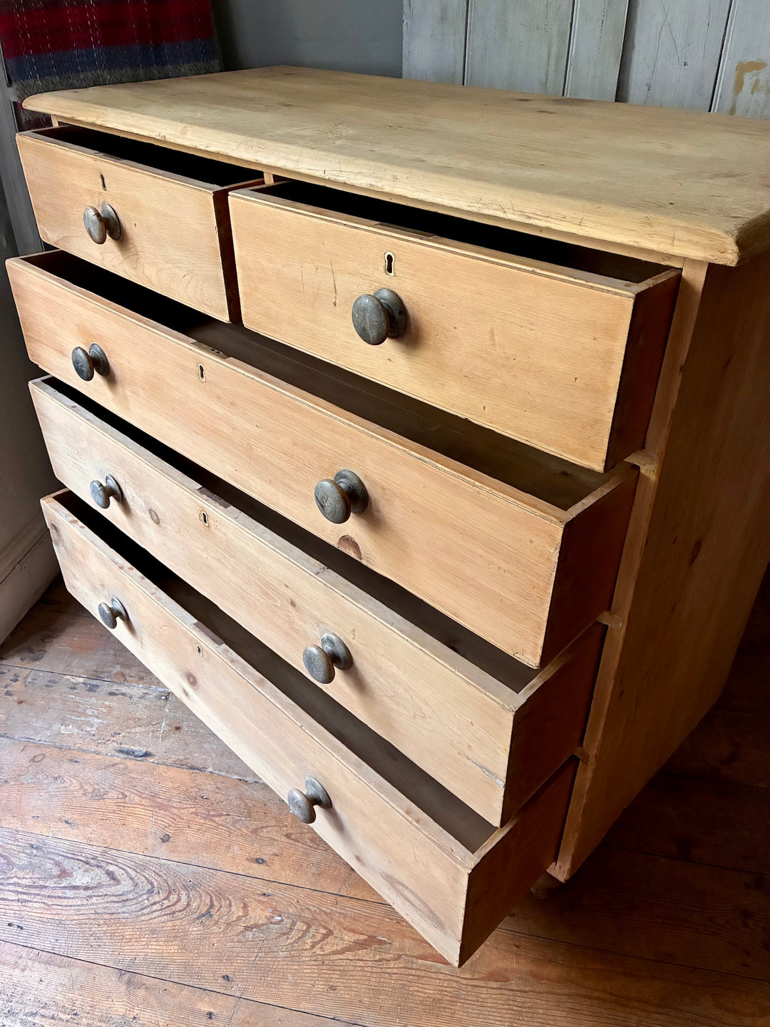Tall Rustic Antique Pine Chest of Drawers with two upper drawers and three lower drawers, featuring wooden knobs.