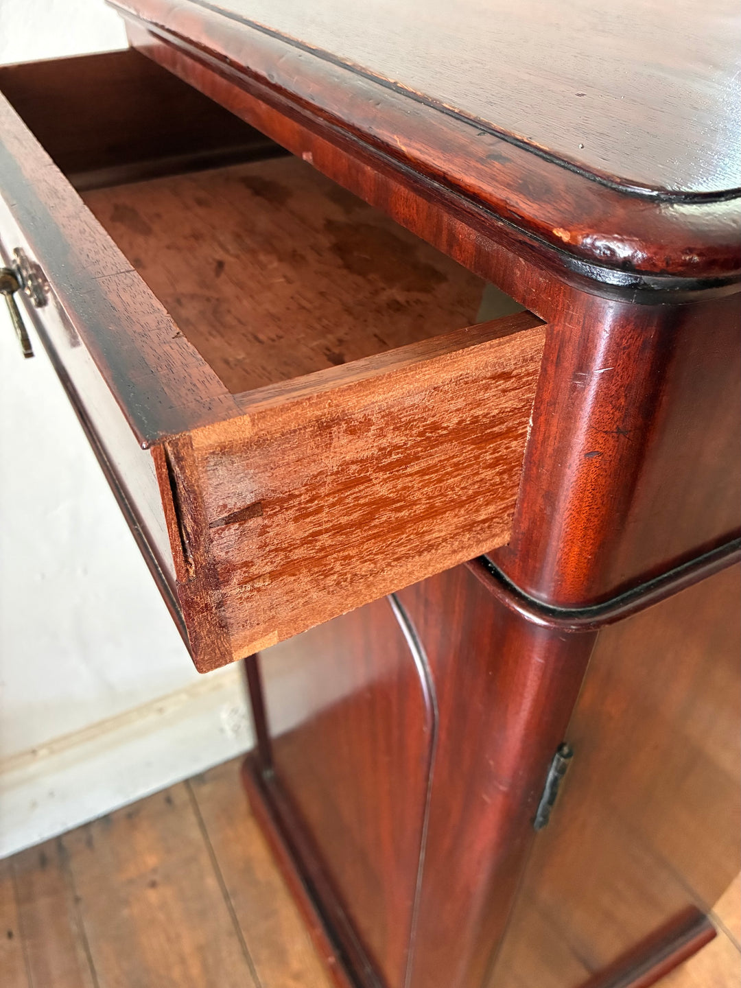 Tall Victorian Mahogany Pot Cupboard drawer open, showcasing rich antique mahogany craftsmanship, perfect for storage.