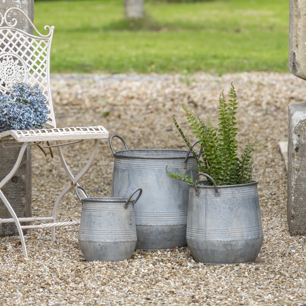 Galvanised zinc planters with handles, perfect for elegant outdoor decor, by Source for the Goose, Devon.