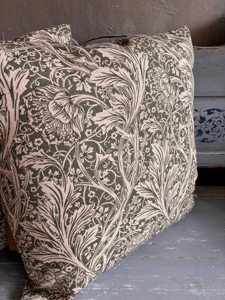 Tanglewood Green Hand Block Print Cushion featuring floral leaf design on a soft neutral background.