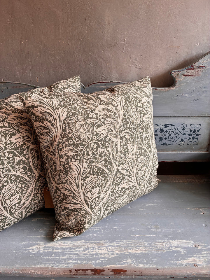 Tanglewood Green Hand Block Print Cushion showcasing floral leaf design on a neutral background, perfect for vintage or modern decor.