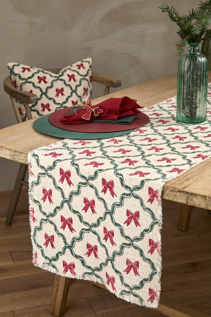 Woven Soft Green Circular Placemat on a rustic table with red bows decor and green tableware accents.