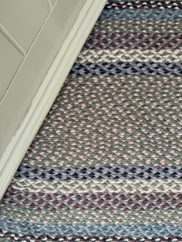 Close-up of a textured, multicolored jute rug in Tundra colourway