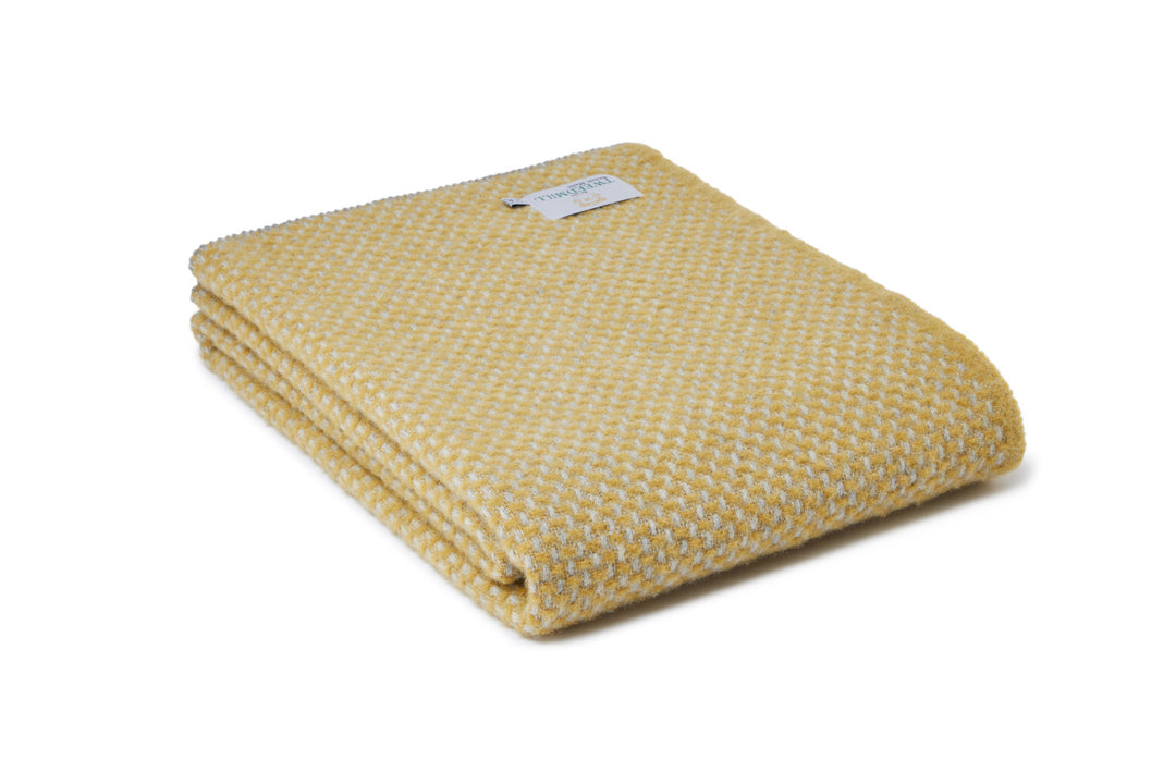 Tweedmill Twill Silver Grey and Mustard Throw folded, showcasing its cozy texture and stylish design. Source for the Goose, Devon.