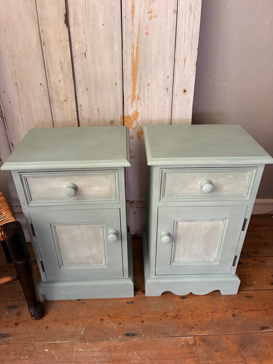 Pair of Painted Pine Bedside Cabinets in Scandi Blue by Source for the Goose Devon on a wooden floor.