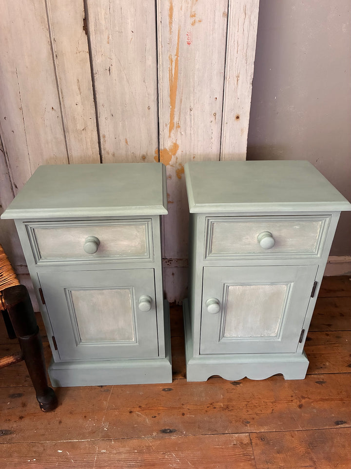 Pair of Painted Pine Bedside Cabinets in Scandi Blue by Source for the Goose Devon on a wooden floor.