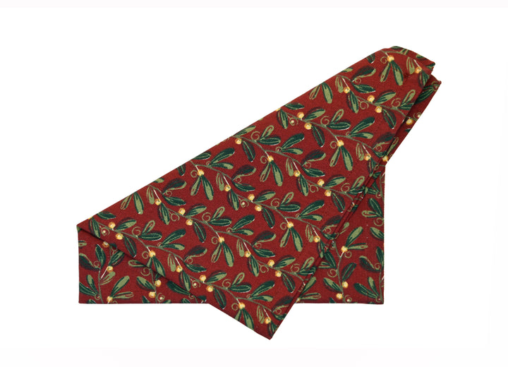 Under The Mistletoe Napkin - Set of Four with festive mistletoe design in gold and red for elegant holiday dining.