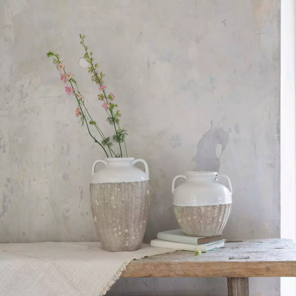 Small Antique White Amphora Vase with pink flowers, showcasing rustic charm and sophistication.
