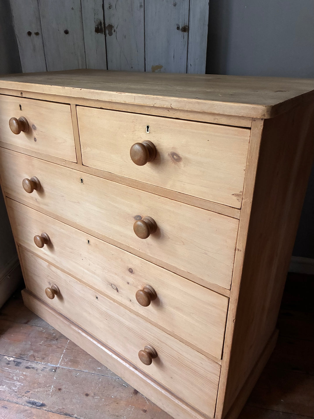 Victorian Antique Pine Chest of Drawers showcasing classic design and natural grain in warm wooden finish.