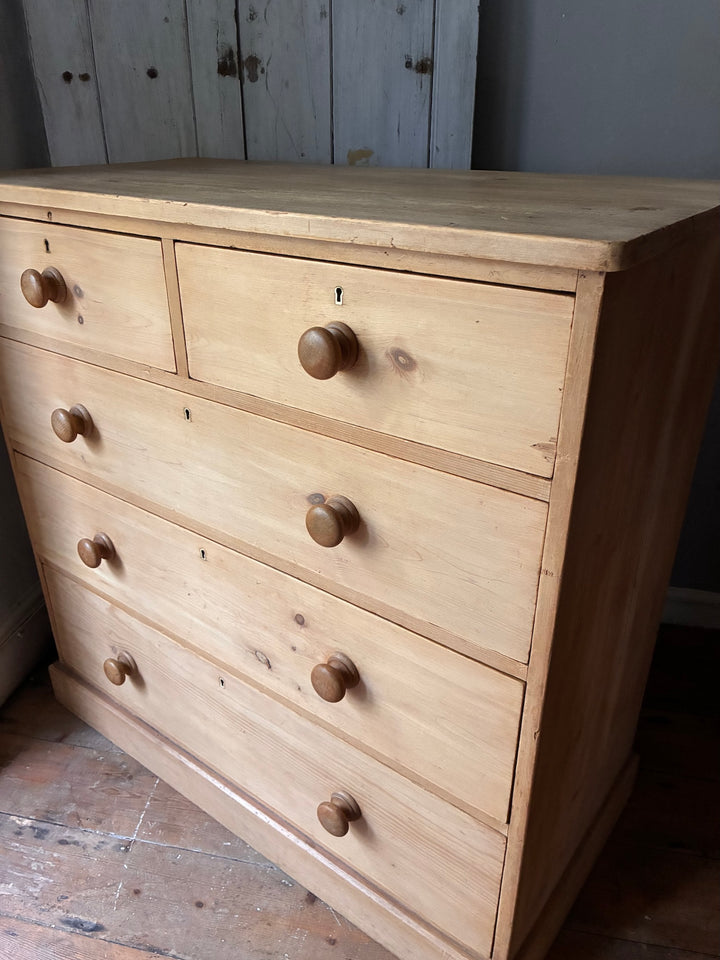 Victorian Antique Pine Chest of Drawers showcasing classic design and natural grain in warm wooden finish.