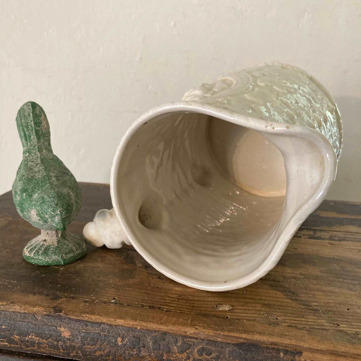 cream coloured Victorian ceramic jug with raised relief design