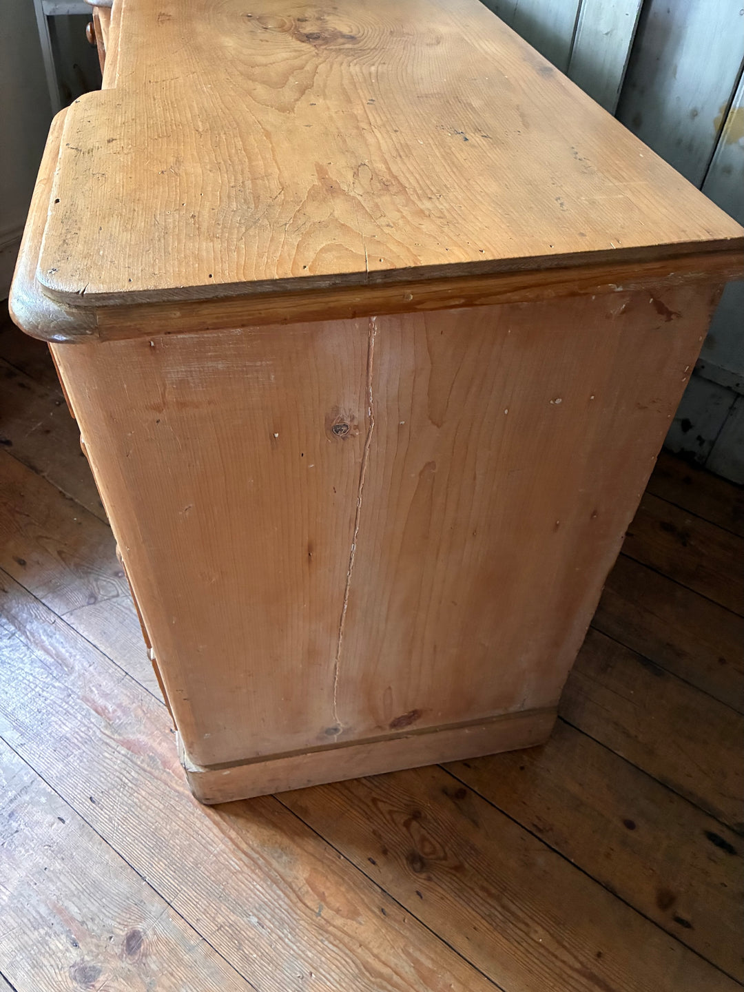 Victorian Antique Pine Pedestal Desk side view showcasing rustic wood texture and classic design details.