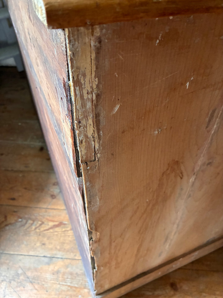Close-up view of wear on the side of a Victorian Antique Pine Pedestal Desk from Source for the Goose, Devon.