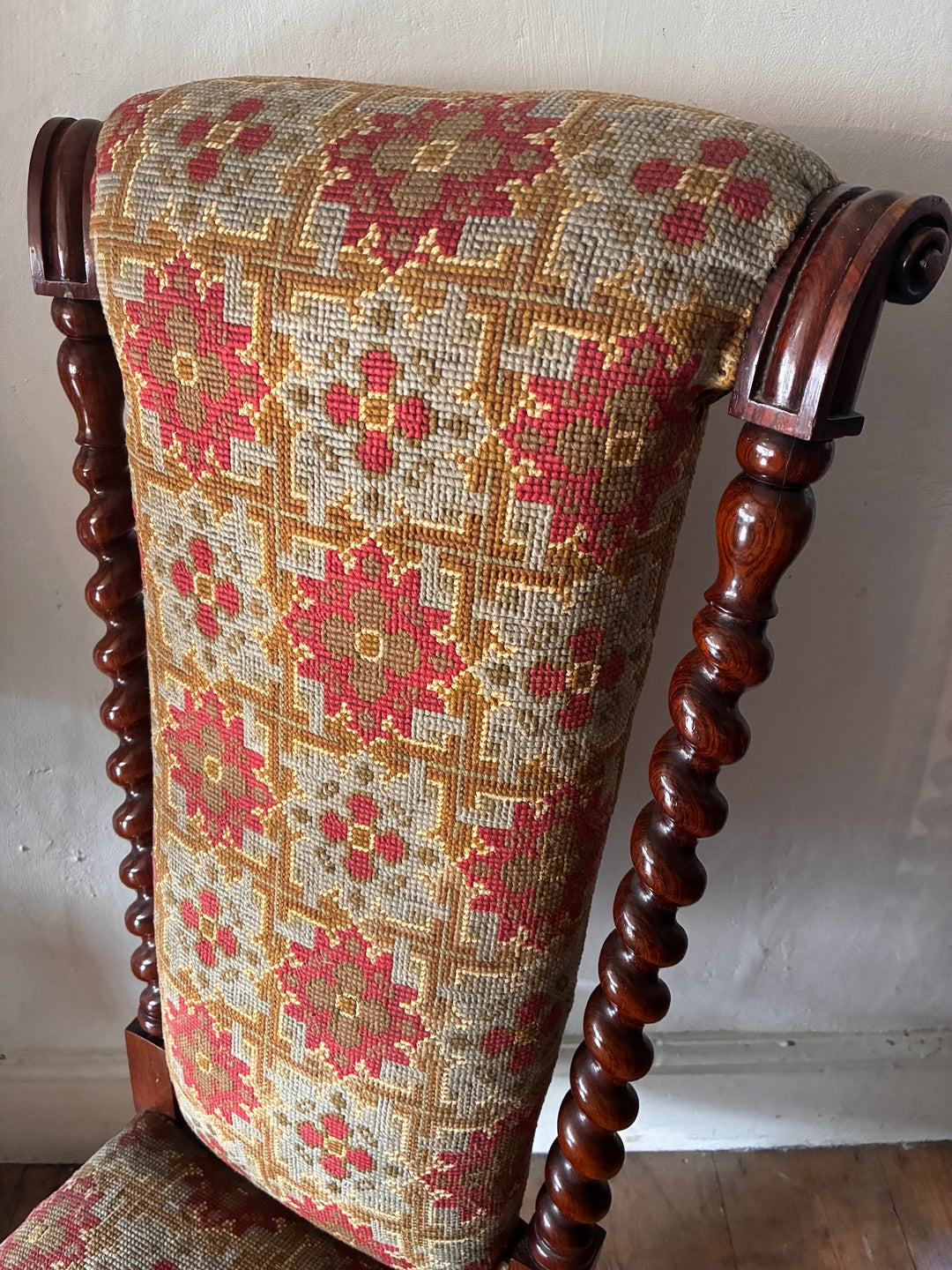 Detail of the Victorian Barley Twist Prayer Chair with original tapestry fabric and barley twist detailing.